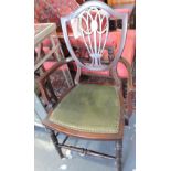 An Edwardian inlaid mahogany elbow chair together with a 1920s elbow chair.