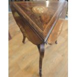 A late Victorian/Edwardian triangular occasional table.