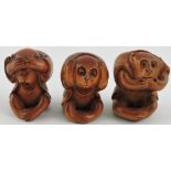 A set of three Chinese hardwood carvings, the three wise monkeys.