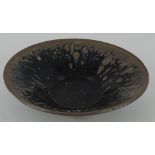 A Jian kiln style tea bowl, with oil -glaze decoration, D. 13cm.