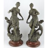 A pair of spelter figures, after Rancoulet, emblematic of the Sea and Stars, H. 53cm.