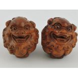 A pair of Chinese carved hardwood dogs of Fo netsuke.
