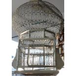 A North African wirework and painted wood pagoda birdcage. H. 72cm.
