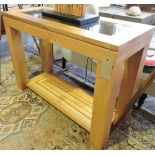 A designer oak two tier console table with rectangular glass inset top on square underframe. W.