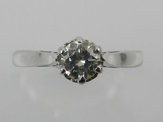 An 18 carat white gold and solitaire diamond ring, the stone of approx. 0.35 carats.