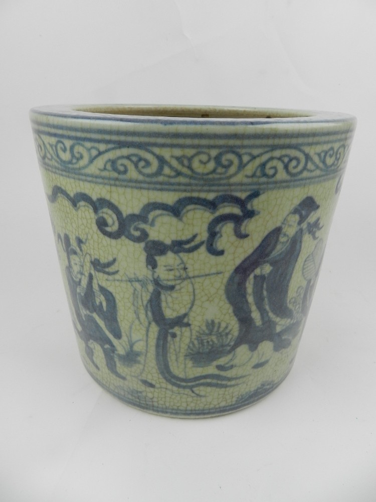 A Chinese blue and white hard paste porcelain brush pot, decorated with figures in landscape scene.