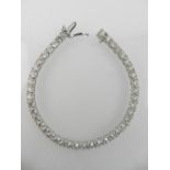 A 14 carat white gold and diamond line bracelet, set 41 brilliant cut stones of approx. 9.15