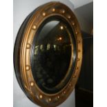 A Regency style circular wall mirror.