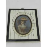 In the 19th century style, an oval miniature half-length seated portrait of a lady,