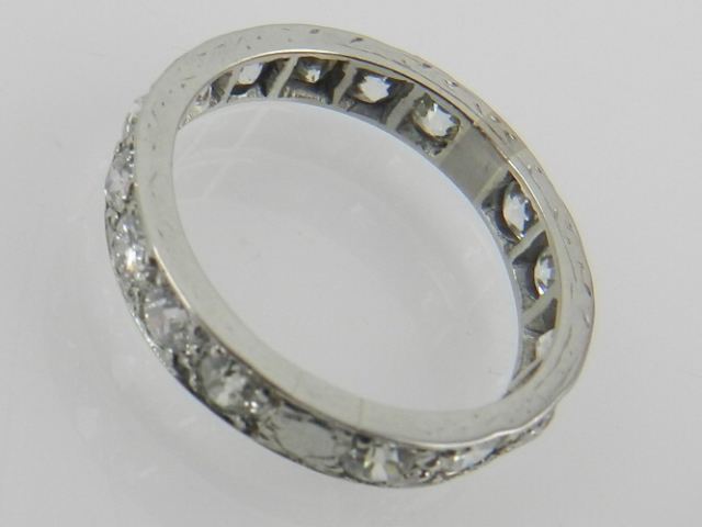 A white metal and diamond eternity ring, set with sixteen diamonds. - Image 2 of 2