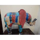 A polychrome garden tin elephant.