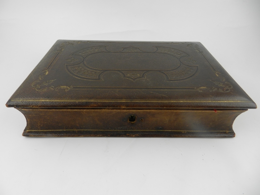 A leather fitted scribes box.