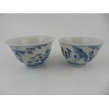 A pair of Chinese hard paste porcelain blue and white tea bowls.