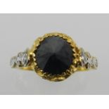 An unusual yellow metal and black diamond ring, the inverted stone of approx. 1.