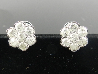 A pair of 18 carat white gold and diamond flower head cluster earrings, set 14 stones of approx. 2.
