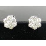 A pair of 18 carat white gold and diamond flower head cluster earrings, set 14 stones of approx. 2.