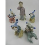 Four Nao Lladro porcelain figurines, modelled as children dressed as clowns,