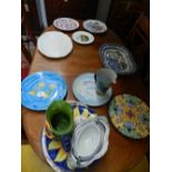 A collection of ceramics, to include clay serving dishes,