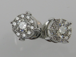 A pair of 18ct white gold diamond cluster ear studs, screw-back fittings, total weight 1ct.