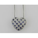 An 18 carat white gold, diamond and sapphire set heart-shaped pendant of lattice design,