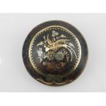 A late 19th century circular damoscened tortoiseshell brooch,