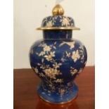 A Spode porcelain baluster shaped urn, decorated with cranes and foliage,