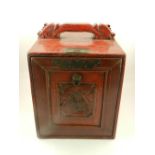 A Chinese scarlet lacquered hardwood table cabinet. H.34cm W.