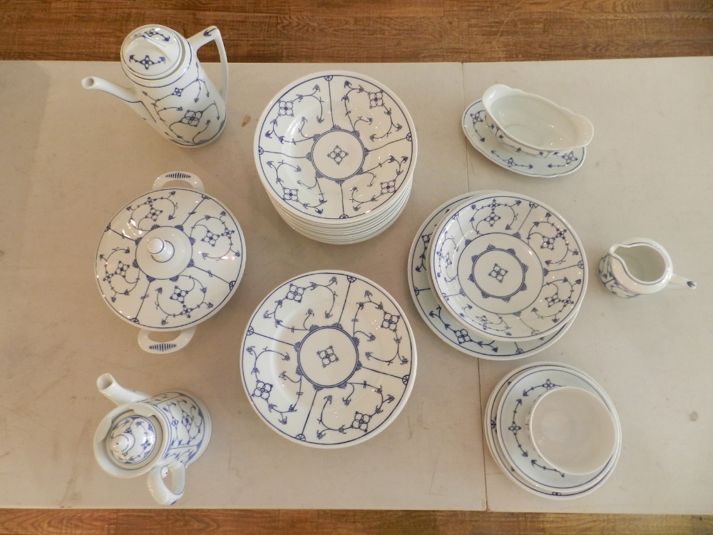 A Eisenberg Blau Saks part dinner and tea service, decorated with stylised flowers and foliage,