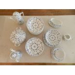 A Eisenberg Blau Saks part dinner and tea service, decorated with stylised flowers and foliage,