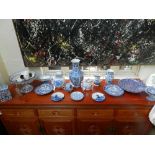 A collection of blue and white ceramics, to include teapots, bowls, vases and chargers.