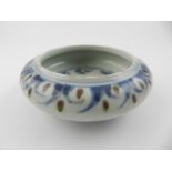 A Chinese hard paste porcelain blue, white, and copper red brush pot,