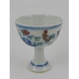 A Chinese Ming style small stem cup, decorated with chickens in landscape,