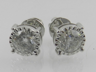 A pair of 18ct white gold diamond solitaire ear studs, with screw-back fittings, total weight 2.