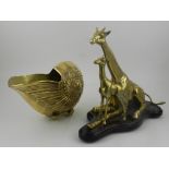 A brass study of a shell, together with a brass study of a giraffe and calf, raised on wooden base.