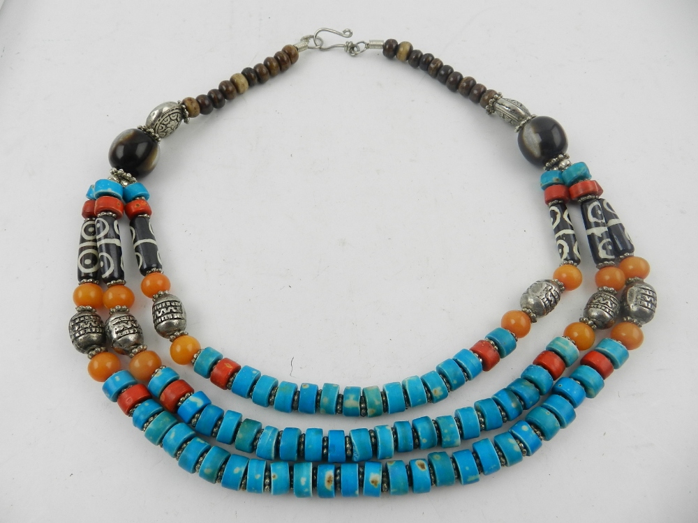 A white metal, coral, and turquoise beaded necklace, together with another similar three strand - Image 2 of 2