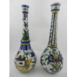 Two porcelain Qajar rose water sprinklers, decorated with flowers and animals.