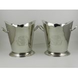 A pair of nickel plated twin-handled wine coolers, engraved with flowers and foliage to front. H.