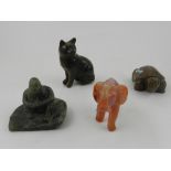 A collection of carved hardstone animals, to include a turtle, a cat, a gorilla, and an elephant.