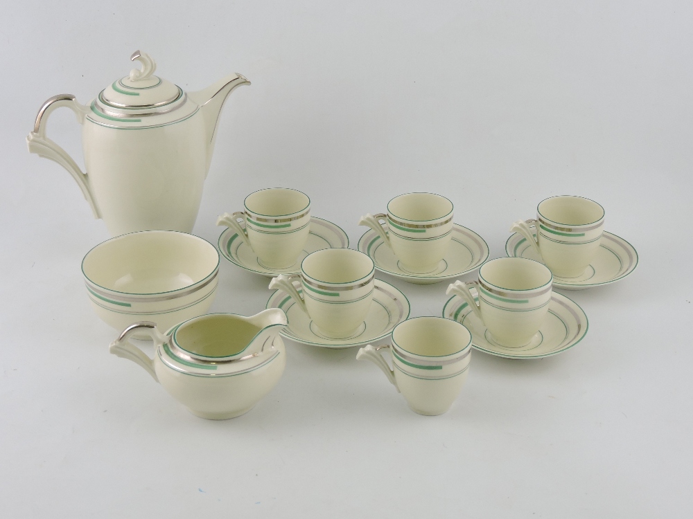 An Art Deco coffee service for six place settings, with silver and sage green line decoration,