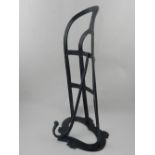 A late Victorian cast and wrought iron equine saddle rest.