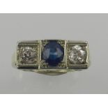 A 14 carat yellow gold, diamond, and sapphire ring,