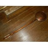 A late Victorian walnut handled and copper bread warming pan.