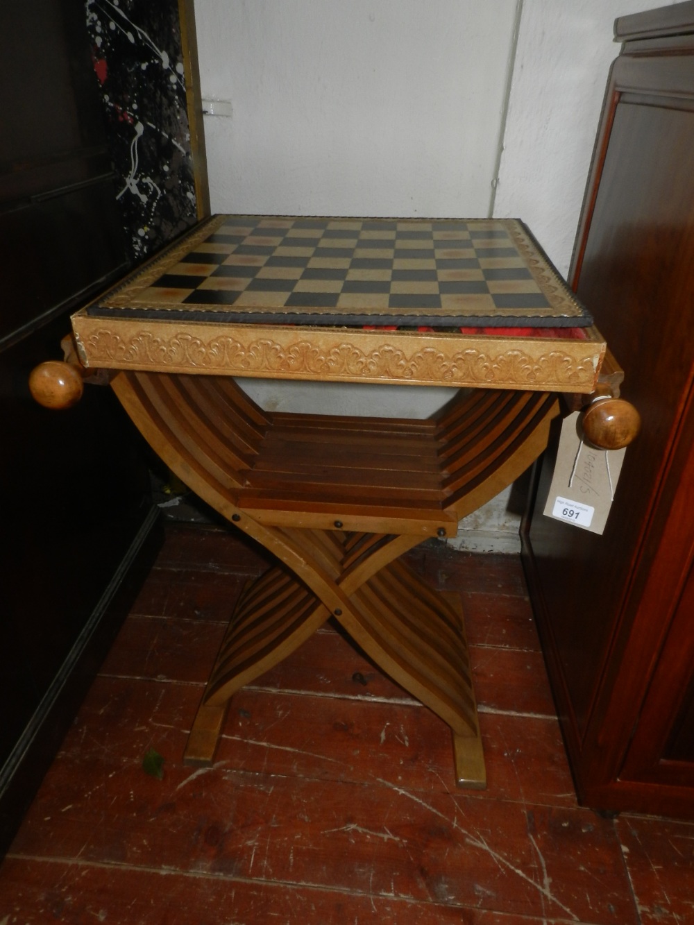 A fold-away chess and backgammon set, having cast metal chest pieces.