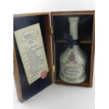 Lladro, Spain. A porcelain brandy bottle, filled and sealed, in original box.