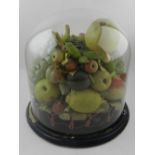 A late 19th / early 20th century carved wax study of fruits, under a glass dome. H.