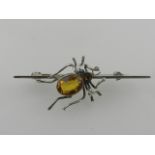 Charles Horner. A silver and citrine set bar brooch in the form of a spider.