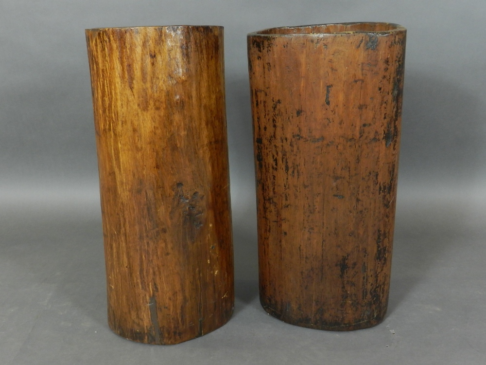 A pair of early 20th century hardwood stick stands, of naturalistic form.