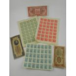 A collection of Chinese stamps and banknotes.