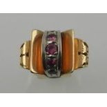 A mid 20th century yellow and white metal and ruby set ring,