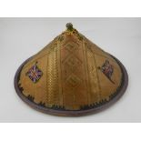 A Vietnamese bamboo hat, silk lined, having embroided union jacks to exterior,